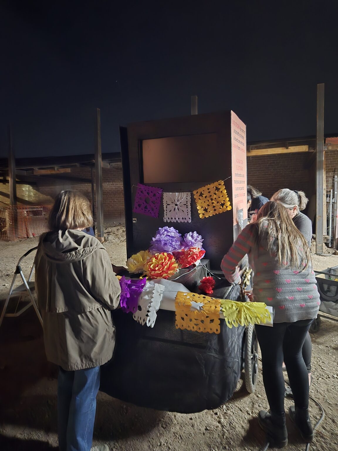 Staff and partners placing decorations on the float.